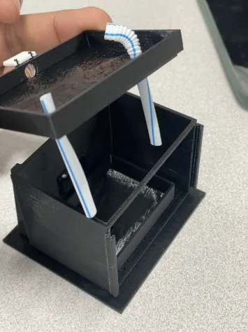 Dam model with the top removed, showing internal tubing