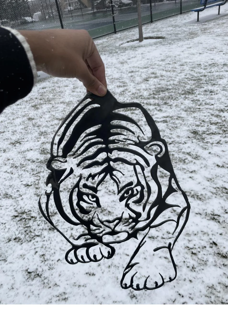 Laser-cut steel tiger detail